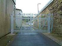 Double leaf galvanised palisade gates with additional top row of rotating spikes
